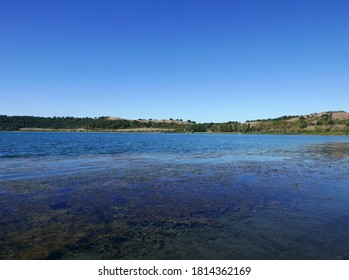 scenic and peaceful view of Martignano lake in Italy - Shutterstock ID 1814362169