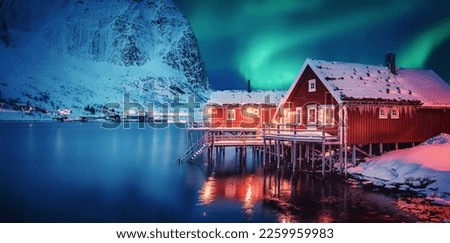 Scenic photo of winter fishing village with northern lights. stunning natural background. Picturesque Scenery of Reinefjord one most popular place of Lofoten islands. Norway. ideal resting place. Stock photo © 