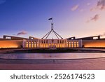 Scenic pink sunset over public building of parliament house in Canberra of ACT, Australia.