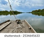 Scenic River Cruise on a Traditional Wooden Boat with Ropes and Calm Views of the Loire’s Natural Shores