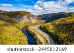 Scenic road in Canadian Mountain Landscape Valley with River. Fall Season. Corner Brook, Newfoundland, Canada.