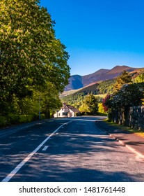 Scenic road leading to one of the most popular towns in the Lake District, Keswick, England. Keswick is a market town in northwest England, surrounded by mountains like Skiddaw.