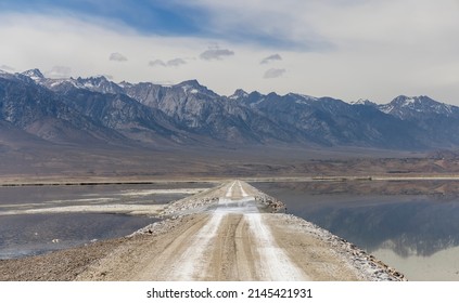Scenic road through Owens lake ,dry salt lake in Eastern California.