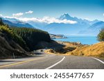 Scenic road trip of Mt Cook or Aoraki over winding road and Lake Pukaki on sunny day at Peters lookout, New Zealand