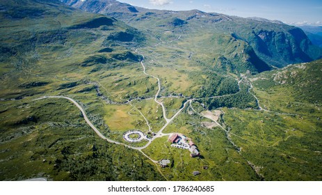 Scenic Road, View From Above. Empty Road. Rocky Road Goes Into The Distance Into The Blue Sky. Mountain Road In The Summer. Mountain Pass In Norway. Top View Through The Fog