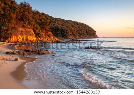 Scenic rocky beach Cala Violina landscape at the sunset. Tyrrhenian Sea bay at the sunset. Province of Grosetto, Italy