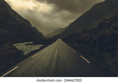 Scenic Rocky Landscape And The Rainy Norwegian Road Ahead. 