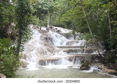 A Scenic Rocky Waterfall Located In Beautiful Jamaica