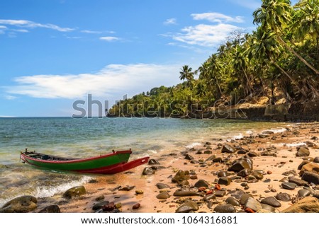 Scenic Ross island sea beach Andaman with wooden boat.