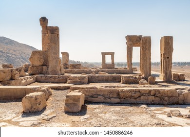 Scenic Ruins Of The Hadish Palace (the Palace Of Xerxes) On Blue Sky Background In Persepolis, Iran. Ancient Persian City. Persepolis Is A Popular Tourist Destination Of The Middle East.