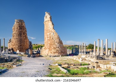Scenic ruins of Hellenistic city gate in Perge (Perga) at Antalya Province, Turkey. Awesome view of the ancient Greek city. Perge is a popular tourist destination in Turkey.