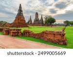 Scenic ruins of Wat Chaiwatthanaram in Ayutthaya, Thailand. Amazing view of the Buddhist temple in the ancient city of the Ayutthaya Kingdom (Siam). Thailand is a popular tourist destination of Asia.