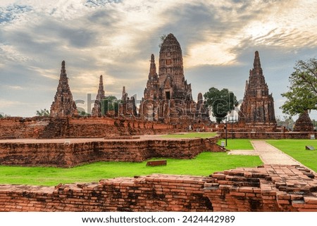 Scenic ruins of Wat Chaiwatthanaram in Ayutthaya, Thailand. Amazing view of the Buddhist temple in the ancient city of the Ayutthaya Kingdom (Siam). Thailand is a popular tourist destination of Asia.