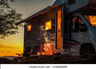 Scenic RV Camping Spot During Sunset. Class C Motorhome Camper Van. Travel Industry Theme.