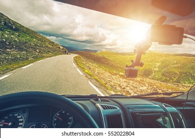 Scenic RV Road Trip. Driving Camper Van Through Mountain Landscape. RV Vacation.