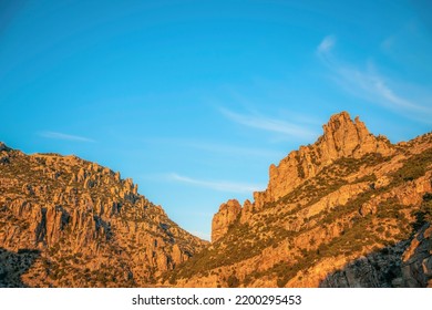 Scenic Santa Catalina Mountain range in Mount Lemmon Arizona against blue sky. A scenic vista of rocky mountains and cliffs with clear sky background on a beautiful day. - Shutterstock ID 2200295453