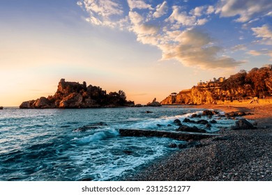 scenic sea shore view of island in ocean with waves and amazing cloudy sunset or sunrise on backgeound, vacation landscape of rocky beautiful isle