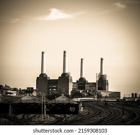 A scenic shot of the Battersea Power Station with train tracks coming from Vauxhall Station