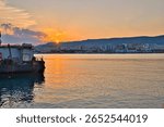 A scenic shot of boats and a waterscape during sunset in Manfredonia Italy