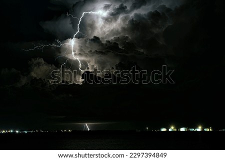 A scenic shot of a lighning strike at night