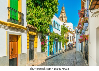 Scenic sight in the picturesque Cordoba jewish quarter with the bell tower of the Mosque Cathedral. Andalusia, Spain. - Shutterstock ID 1514178038