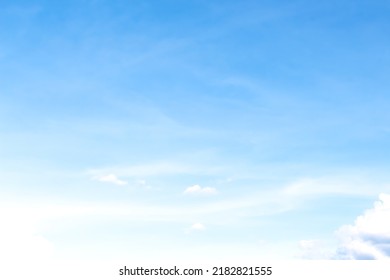 Scenic soft clouds on bright blue sky and light wind vast background