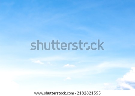 Scenic soft clouds on bright blue sky and light wind vast background