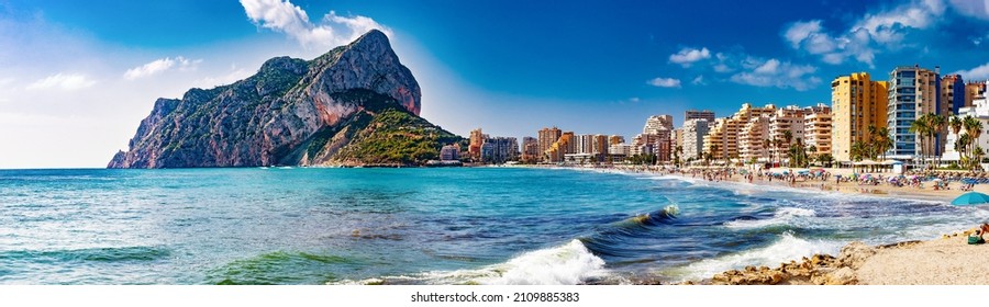 Scenic Spain beach sunset.Rock of Penon by Ifach. Mediterranean coast landscape in the city of Calpe. Coastal city located in the Valencian Community, Alicante, Spain. - Shutterstock ID 2109885383
