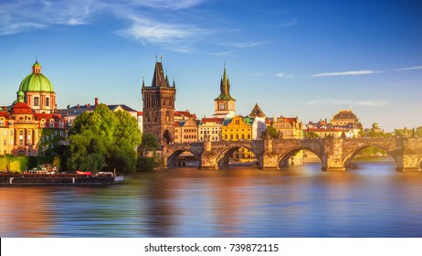 Scenic spring sunset aerial view of the Old Town pier architecture and Charles Bridge over Vltava river in Prague, Czech Republic - Shutterstock ID 739872115