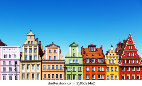 Scenic summer background view of the ancient classic color homes or houses architecture buildings with blue sky in the Old Town of Wroclaw, Poland