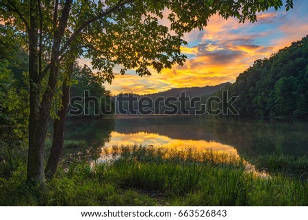 Scenic summer sunset over calm mountain lake, Appalachian Mountains