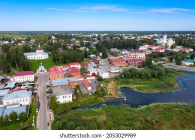 Scenic Summer View From Drone Of Ancient Town Of Myshkin Located On Steep Left Bank Of Volga Overlooking Modern River Station And Medieval Temples, Russia..