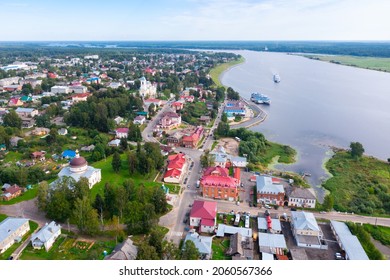 Scenic Summer View From Drone Of Ancient Town Of Myshkin Located On Steep Left Bank Of Volga Overlooking Modern River Station And Medieval Temples, Russia..