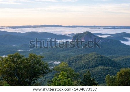 Scenic sunrise view of Looking Glass Rock, a popular climbing and hiking destination attraction in Pisgah Forest of Brevard, near Asheville, North Carolina