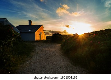 Scenic Sunset Behind The Dunes Of Vejers Strand (Denmark - The Golden Light Shines On The Facade Of A Simple Contemporary Vacation House