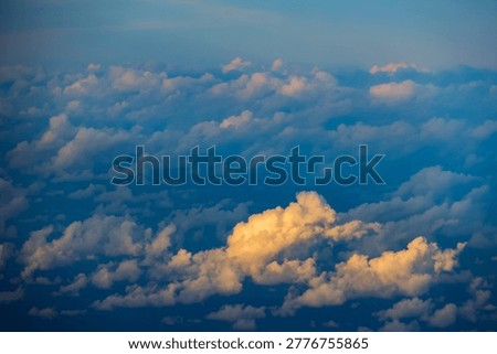 Scenic sunset clouds and sun rays seen from a plane