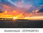 Scenic sunset over Moonta Bay Jetty with people enjoying the view, featuring vibrant sky colors, Copper Coast, Yorke Peninsula, South Australia