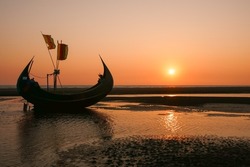 Scenic Sunset Seascape With Beautiful Traditional Wooden Fishing Boat Known As Moon Boat On Beach, Cox's Bazar, Bangladesh