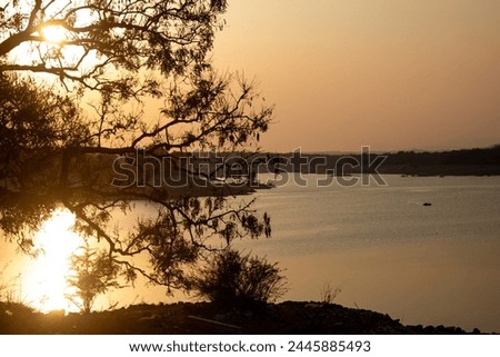 Scenic sunset view of water storage at Sathanur Dam which forms the Sathanur reservoir.  Sathanur Dam is one of the major dams in Tamil Nadu constructed across the Thenpennai River.