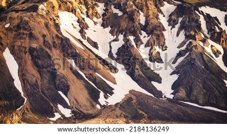 Scenic of surface volcanic mountain with snow covered in Fjallabak nature reserve on Icelandic highlands at Landmannalaugar, Iceland