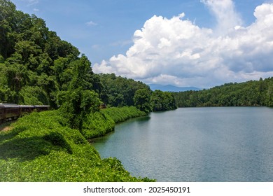 Scenic Train Ride Through The Mountains With Pristine Lake Views