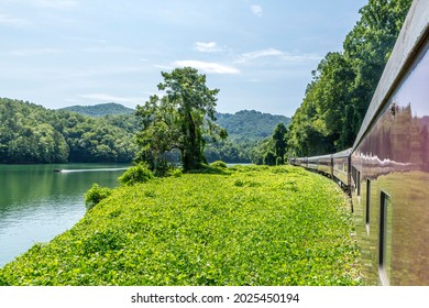 Scenic Train Ride Through The Mountains With Pristine Lake Views