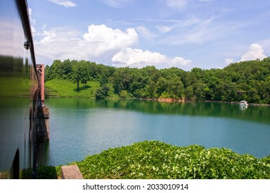 Scenic Train Ride Through The Mountains With Pristine Lake Views