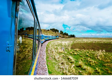 Scenic Train Ride With View Of Mountains And Greenery            