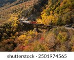 Scenic train at Trestle bridge in North Conway in Autumn, New Hampshire