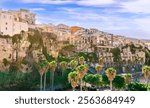 scenic travel landscape of beautiful historic town Tropea in Italy with old antique buildings, vintage houses on a high rock cliff above sea and amazing blue sky on background