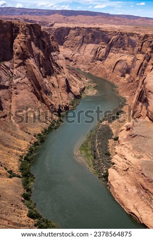 Scenic Vertical Shot of Horseshoe Bend canyon overlooking Colorado River in Page Arizona, USA.