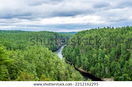 Scenic view from the Barron Canyon Trail in Algonquin Provincial Park, Ontario, Canada August 2022. The natural beauty of the rock cliffs and trees overlooking the Barron River.