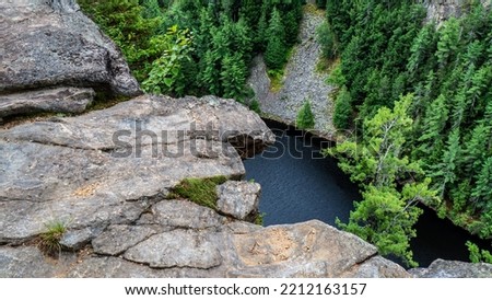 Scenic view from the Barron Canyon Trail in Algonquin Provincial Park, Ontario, Canada August 2022. The natural beauty of the rock cliffs and trees overlooking the Barron River.