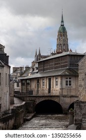 Scenic View In Bayeux, Normandy, France.  Walking Along The Canal Towards The Bayeux Tapestry Museum.